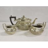 Silver three piece teaset of half fluted form, Chester 1907, 25oz