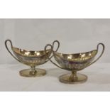 Pair of e.p. on copper boat shaped twin handled salts