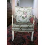 Painted upholstered armchair with button seat.