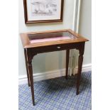 Walnut vitrine table, inlaid banding and square tapered supports.