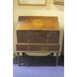 Reproduction walnut bureau on stand in the George I style, burr panels, two short and two long