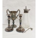 Pair of e.p. on copper candlesticks, claret jug and twin handled epns Britannia metal trophy cup. (