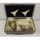 Pair of silver sauce boats, scroll handles and two silver ladles, cased