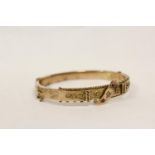 Victorian gold hinged bangle with scroll of rubies and diamond brilliant. "9ct". 9.5g