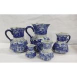 Set of five reproduction blue and white Ironstone jugs. the largest 24cm, smallest 10cm