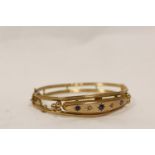 9ct gold hinged bangle with sapphires and tiny diamond chips, Chester 1909. 8g