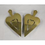 Pair of brass trivets, each of pierced spade shape and another. (3)