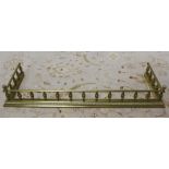 19th century brass fender with urn turned supports. 122cm internal width