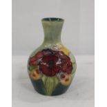 Moorcroft Pottery small Orchid baluster vase with green ground, 10cm
