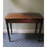 Victorian mahogany fold-over top tea table, curved corners on turned baluster supports, 93cm wide.