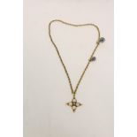 Gold necklet with two "eye" charms and pearl set cross, .750