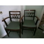 Pair of 1920's oak carver elbow chairs with slip in seats.