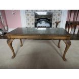 Rectangular coffee table, inset glass top, on cabriole supports.