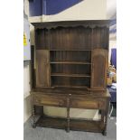 1920's oak "Welsh" dresser, plate rack and cupboards above two drawers on spiral twist supports,