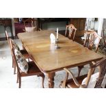 Victorian mahogany wind out dining table with two leaves, rectangular form with curved corners on