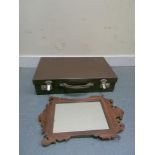 Small leather suitcase, 51cm wide and a fret carved mirror