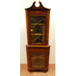 Edwardian mahogany and inlaid corner cabinet, the swan neck pediment over astragal glazed doors,