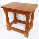 Oak stool by Robert 'Mouseman' Thompson, with rectangular top on octagonal turned legs united by