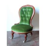 Victorian mahogany lady's button-back chair with foliate carved rail over oval seat, raised on