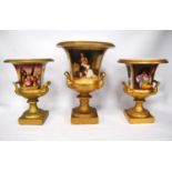 Graduated set of three urns, each with gilt and foliate decoration, scenic panels, the large