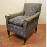 Edwardian armchair with stuff-over back and arms, raised on square tapering legs, 76cm wide, 88cm
