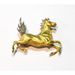 18ct gold brooch modelled as a prancing horse with diamond-set mane and flaring tail, 1965,