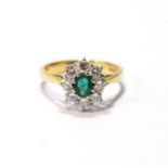 Diamond and emerald oval cluster ring with eight brilliants, in 18ct gold, 1899, size N½.