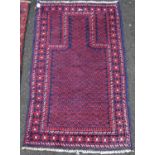 Prayer rug with simple mihrab, blue ground, and all over rosettes, 140cm x 86cm.