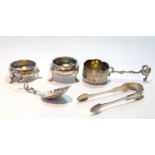 Silver circular salt, 1770, another, embossed, 1869, sugar tongs, 1818, a Dutch embossed strainer,