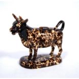 19th century spongeware cow creamer, with impressed mark to the base, 13cm wide, and 14cm high.