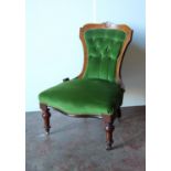 Victorian mahogany lady's button-back chair with rosette carved frame, serpentine seat, raised on