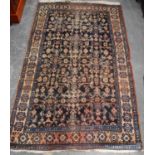 Persian rug with all over geometric design over blue ground, and triple border, 203cm x 120cm.