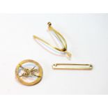 Gold circular brooch with pearl-set swallow, '9c', a wishbone brooch, probably 15ct, and a 9ct