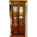 Empire-style mahogany display cabinet, the carved projected cornice over Greek key frieze,
