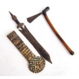 Tribal Polynesian axe with wooden handle and etched fan-shaped blade, together with a knife with