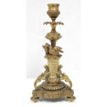 19th century gilt metal candlestick with pierced ivory column surmounted by two birds, trefoil