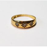 Diamond ring with three star-set old-cut brilliants, in 18ct gold, c. 1910, 3.3g, size S.