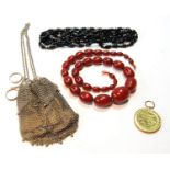 Silver mesh purse, a Great War bronze medal, and two bead necklets.