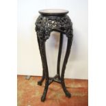 Oriental hardwood and marble-inset jardinière stand, the beaded circular top over pierced, carved