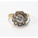 Diamond cluster ring with millegrain-set brilliant, approximately .75ct, surrounded by smaller old-