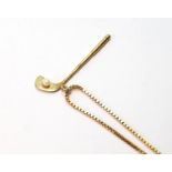 9ct gold pendant modelled as a golf club, with pearl ball, on necklet, 10g.