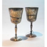 Pair of silver wine goblets, engraved with scrolls, on turned stems, Birmingham 1965/8, 8oz.