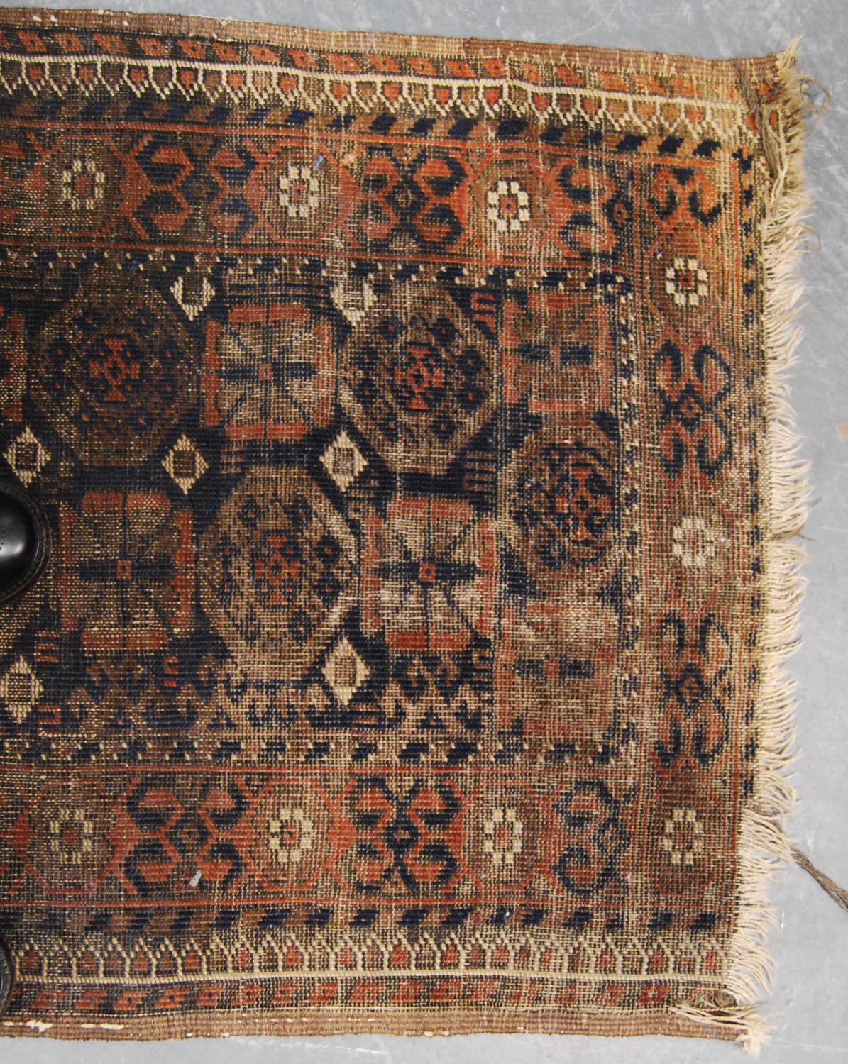 Eastern rug with two rows of eleven rosettes over faded brown ground, and triple border, 142cm x - Image 2 of 4