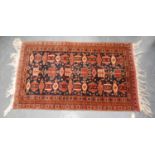 Persian rug with three rows of geometric patterns over black ground, and triple border, 127cm x