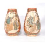 Pair of large Satsuma vases, each with opposing panels depicting traditional figures, 27cm high.