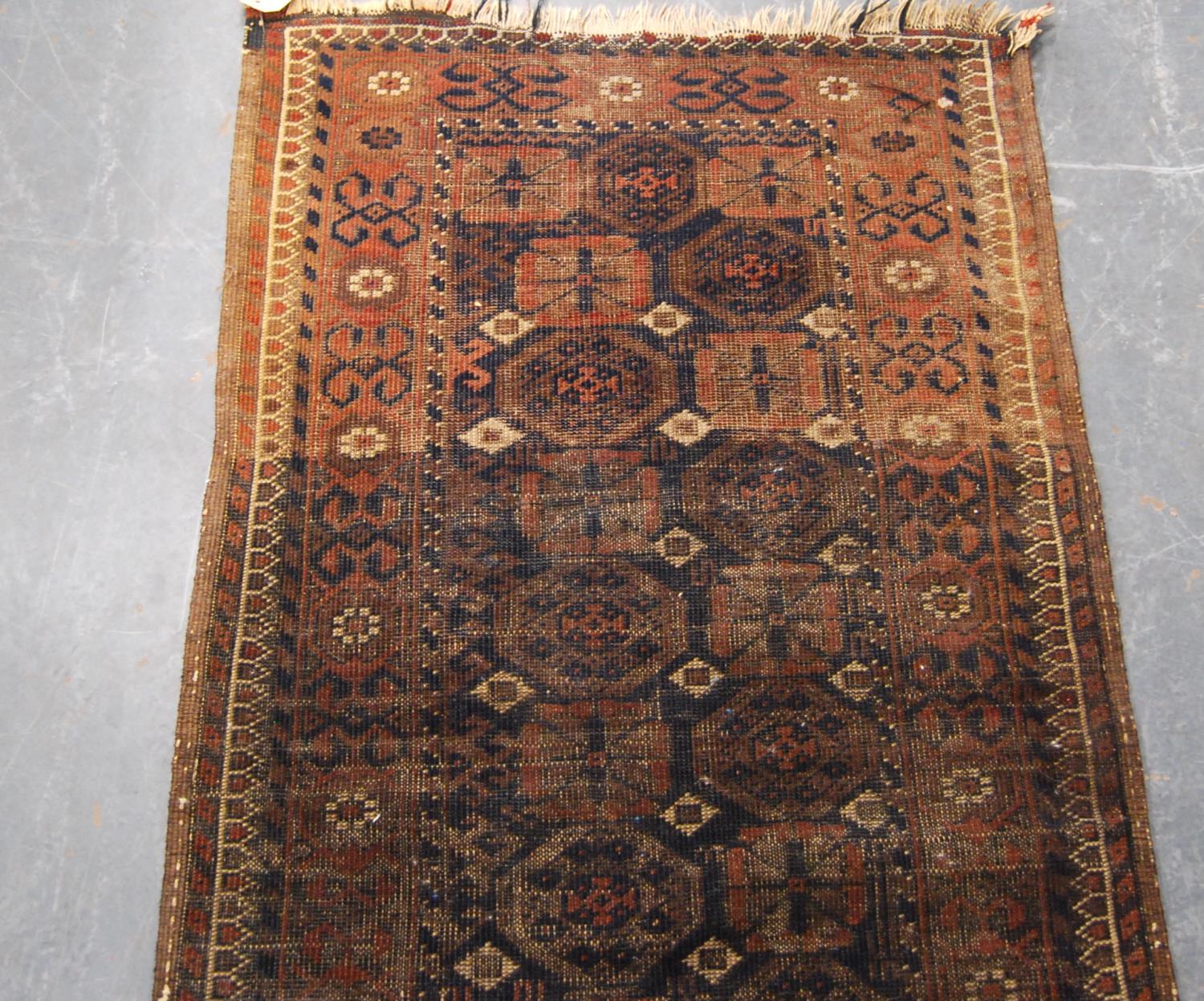 Eastern rug with two rows of eleven rosettes over faded brown ground, and triple border, 142cm x - Image 3 of 4