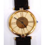 Cartier Vermeil quartz watch, silver gilt, with French control marks, 30mm, on strap.