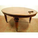 Victorian mahogany oval extending dining table, the moulded top over beaded frieze, raised on