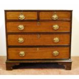 George III oak chest with rectangular top over two short and three graduated long drawers, raised on