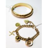 9ct gold double curb bracelet with various charms, 24g, also a rolled gold hinged bangle.
